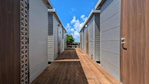 a hallway between two buildings with a wooden floor at Yonagunijima Hotel Munbu Stay Higawahama - Vacation STAY 14752v in Sonai