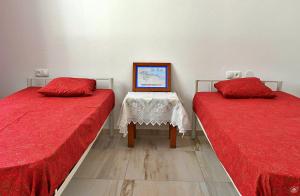 Postel nebo postele na pokoji v ubytování Casa Magui e Cláudio