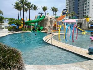 a pool with a water slide in a resort at Salinas Premium Resort in Salinópolis