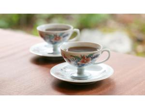 two cups of coffee sitting on a wooden table at Ryokan Akebono - Vacation STAY 97651v in Saga +15 photos