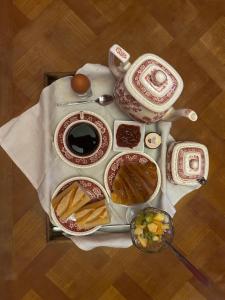 a table with a teapot and a teapot at Manoir de Manapany in Angliers +37 photos