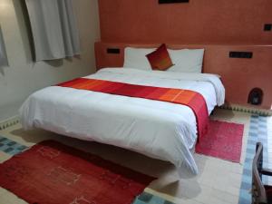 Postel nebo postele na pokoji v ubytování Kasbah Zitoune
