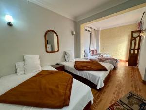 Postel nebo postele na pokoji v ubytování Gina Motel Dahab
