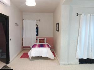 Postel nebo postele na pokoji v ubytování Kasbah Zitoune