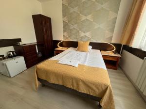 a bedroom with a bed in a room at Hotel Gloria Budapest City Center in Budapest