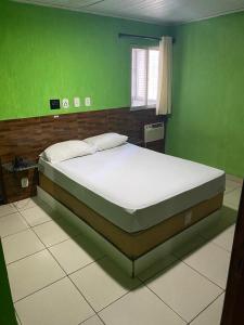 En eller flere senge i et værelse på Hotel Atlanta - Salvador - BA