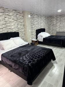 Postel nebo postele na pokoji v ubytování Hotel Canela 96
