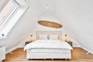 a bedroom with a white bed and a large window at Ankerplatz SPO 2 in Böhl