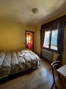 Postel nebo postele na pokoji v ubytování Albergo Eden