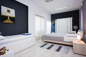 Postel nebo postele na pokoji v ubytování House KALA