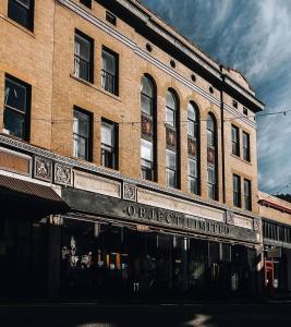 an old brick building with the words oberliest limited at Object Hotel 1BR Room 3A in Bisbee