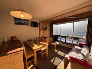 a living room with a couch and a table at Résidence Grand Serre Che B - Appartement · Lumineux · Proche des pistes · Vue montagne MAE-4471 in La Salle Les Alpes +6 photos