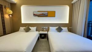 Rúm í herbergi á 禾夏民宿Her Shot Inn