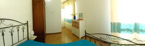 A bed or beds in a room at Casa al Mare con Giardino Privato