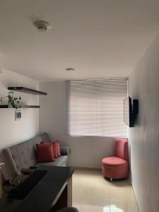 Et opholdsområde på Cómodo Apartaestudio