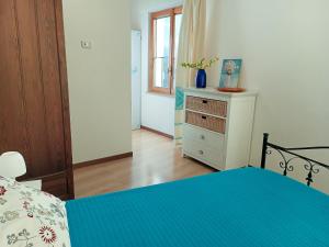 A bed or beds in a room at Casa al Mare con Giardino Privato