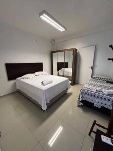 Ένα ή περισσότερα κρεβάτια σε δωμάτιο στο Casa em São gabriel