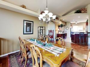 a dining room with a table and chairs at High Expectations in Ruidoso +39 photos