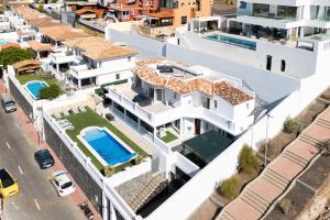 an aerial view of a house with a swimming pool at Villa Tropical in Adeje