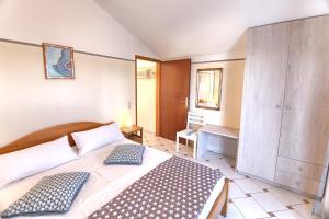 Posteľ alebo postele v izbe v ubytovaní Apartment Rosa
