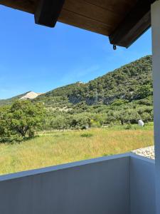 a view of a mountain from the balcony of a house at Villa Karmen in Barbat na Rabu
