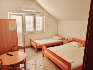 Postel nebo postele na pokoji v ubytování Apartment Vido