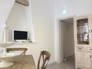Televízia a/alebo spoločenská miestnosť v ubytovaní Casa Ilva