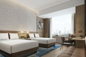 Letto o letti in una camera di Four Points by Sheraton Hengyang Zhengxiang