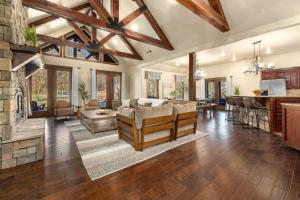 a living room with a couch and a fireplace at Whispering Brook in Springdale