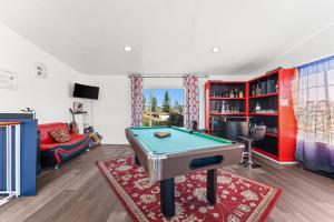 a living room with a pool table in it at Colorful and Cozy Haven with Heated Pool in Rodeo