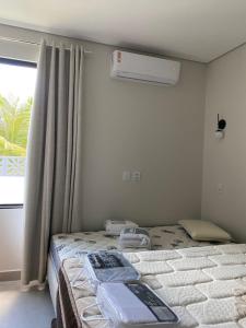 Postel nebo postele na pokoji v ubytování Casa de Praia em Guaratiba