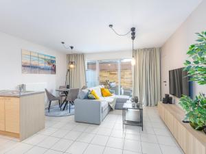 Posezení v ubytování Ground-Floor Apartment
