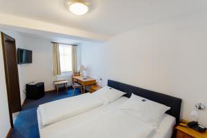Voodi või voodid majutusasutuse Hotel Alt-Ringlein toas
