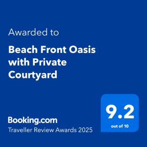 Un certificado, premio, letrero u otro documento en Beach Front Oasis with Private Courtyard