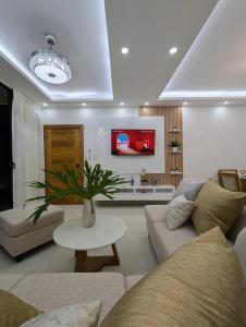 a living room with a couch and a table at Marbella in San Felipe de Puerto Plata +22 photos