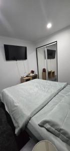 Postel nebo postele na pokoji v ubytování Favona Airport Accomodation