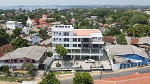 an aerial view of a white building in a city at Blackpool Complex - Lavender in Trincomalee