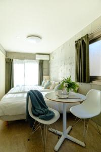 Postel nebo postele na pokoji v ubytování DeLIGHT HOTEL