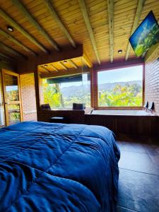Postel nebo postele na pokoji v ubytování Glamping Cabaña Pacha Neusa