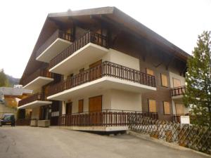 a building with balconies on the side of it at Apartment in Veysonnaz with Private Balcony in Veysonnaz