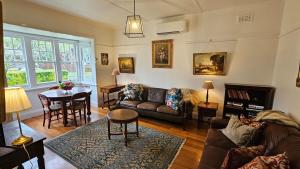 a living room with a couch and a table at 'The Gardenia' Trentham in Trentham