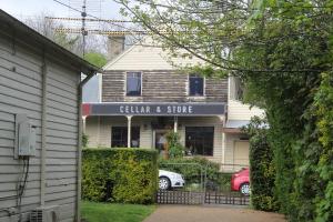 a building with a sign that reads gillian and store at 'The Gardenia' Trentham in Trentham
