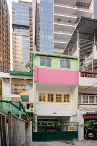 a colorful building with an airplane flying over it at Ban Suanlum in Bangkok
