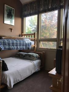 Ένα ή περισσότερα κρεβάτια σε δωμάτιο στο 4BR ski on ski off Hunter Mountain Highlands Condo