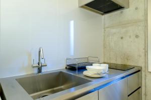 Kuchyň nebo kuchyňský kout v ubytování DeLIGHT HOTEL