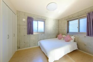 Postel nebo postele na pokoji v ubytování DeLIGHT HOTEL
