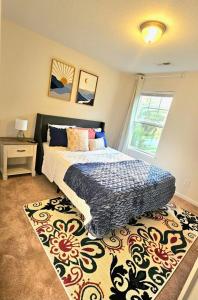 a bedroom with a bed and a rug at Prime Location in Chesapeake with Spacious 4BR & Big Kitchen in Chesapeake