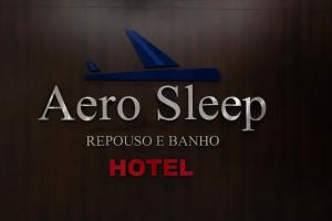 a sign for a zero sleep hotel with a plane at Hotel Aero Sleep Campinas in Campinas