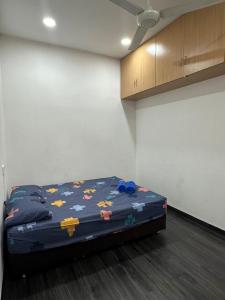 Кровать или кровати в номере ILoveHoliday Homestay Sri Kepayan +4 фотографии