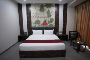 Hotel Sastha Grand客房内的一张或多张床位